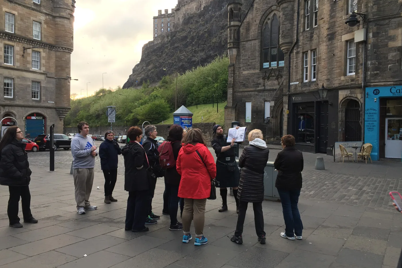 A Historic Edinburgh Tours group gathered below the Castle rock